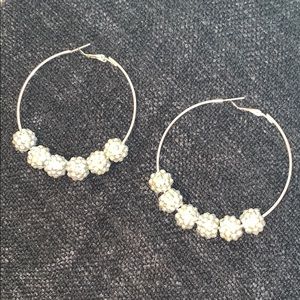 Huge beaded hoops.